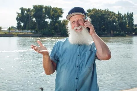 Old man talking on the phone Stock Photos