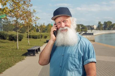 Old man talking on the phone Stock Photos