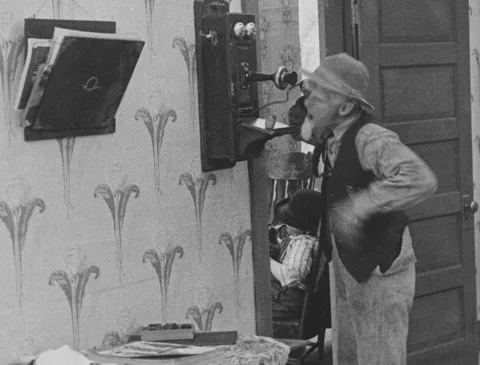 Old Man Talks on Telephone Stock Footage 151235877