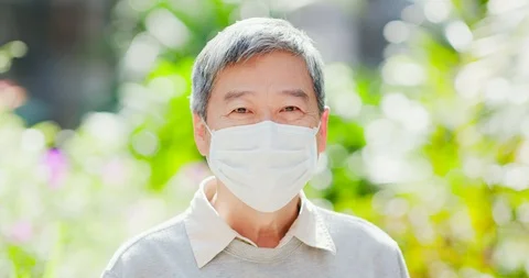 Old man thumbup with mask Stock Footage 99026500