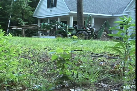 Old man with tractor   Stock Footage 739634