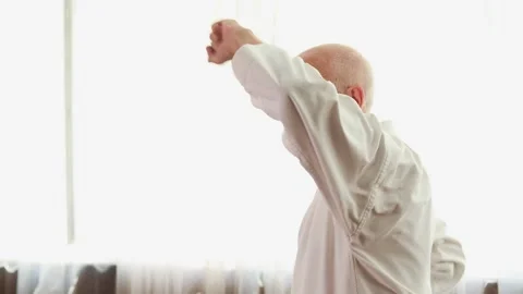 Old man trainer doing blocks with hands Stock Footage 306538633