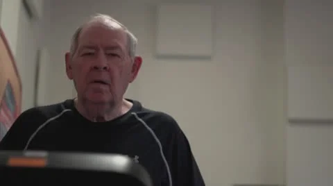 Old man on treadmill face and feet Stock Footage 10716839
