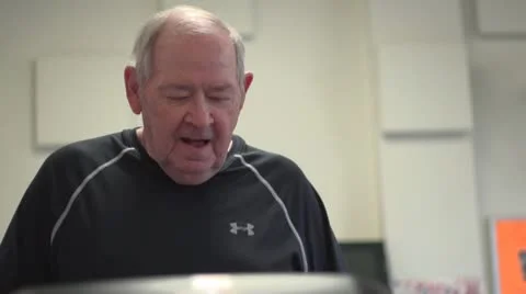 Old man on treadmill Stock Footage 10716843