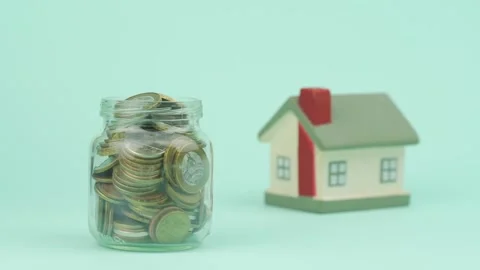 Old man trembling hand puts coin into transparent container Stock Footage 134997730