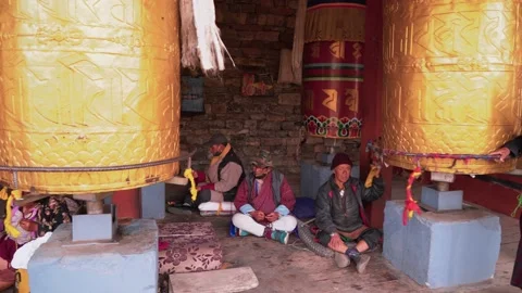 Old man turning prayer wheels in National Memorial Chorten in Thimphu, Bhutan Stock Footage 236006655