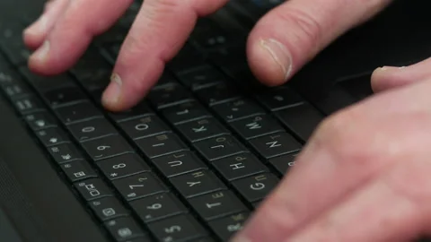 Old man typing on laptop Stock Footage 234295780