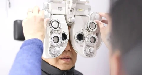 Old man undergo eye test | Stock Video | Pond5