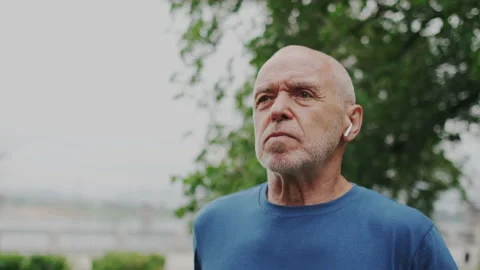 Old Man Using Cellular Smart Watch and Checking Pulse. Starting Training Outside Stock Footage 148465789