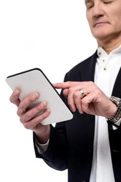Old man using his tablet pc Fotos Stock