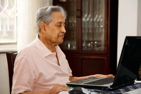 Old man using internet Stock Photos