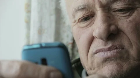 Old man using new technology: mobile phone, cell phone, smartphone Video stock 48058671