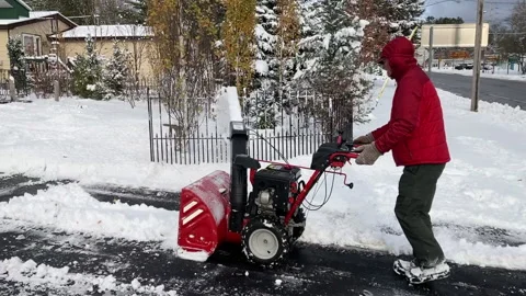 Old man using snowblower Stock Footage 142487309