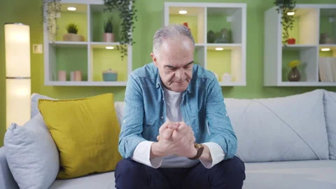 The old man is waiting for someone and looks at his watch. Stock Footage 237795285