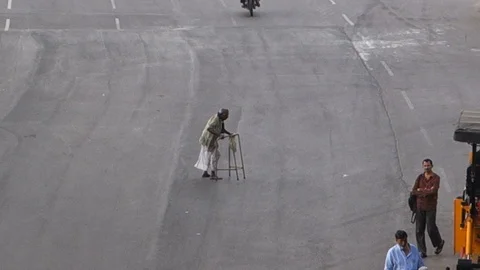 Old-man-with-walker-crossing-street-india Stock Footage 96188101