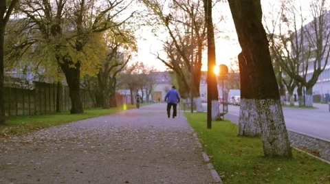 Old Man Walking Alone in the Sunset Stock-Footage 56984864