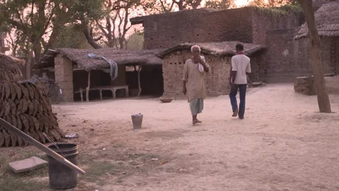 Old man walking along the path in a village- Shot on Sony FS7 Stock-Footage 90854286