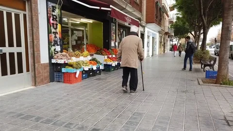 Old Man Walking with a Cane Stock Footage 101389100