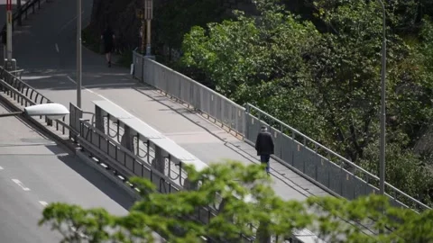 Old man walking over bridge Video stock 132134953