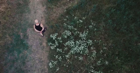 Old Man walking in the park Overhead view with drone Stock Footage 111273068