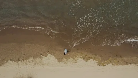 Old Man Walking on the Shore Top View Stock Footage 124308995