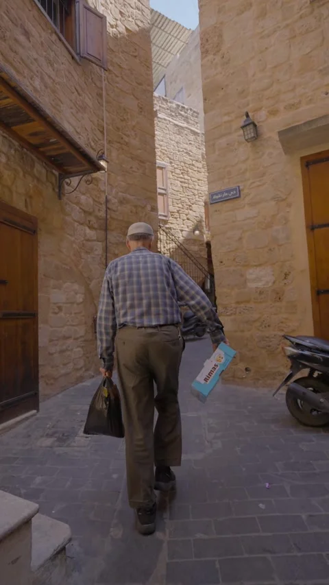 Old man walking in street Video stock 274487219
