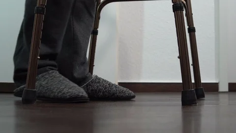 Old Man Walks With Walker Low Angle Stock Footage 109194246