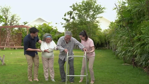 The old man was walking with a walker in the backyard Stock-Footage 139504671