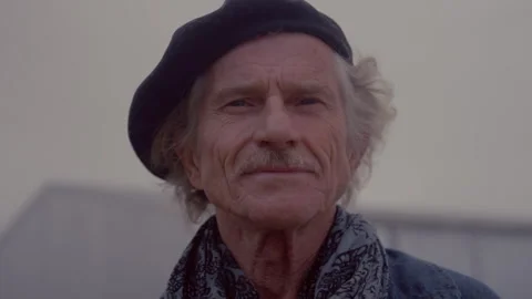 Old man wearing a cap and looking straight at the camera Stock Footage 279770062