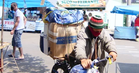 Old man wearing mask during coronavirus pandemic. Street Market, Brazil Stock Footage 140209588