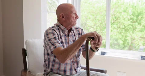 Old man, window and thinking on cane in nursing home, memory and support for Stock Footage 267065103