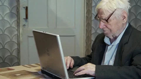 Old man working on computer Stock Footage 46503435