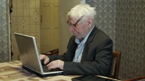 Old man working on computer Stock Footage 46503445
