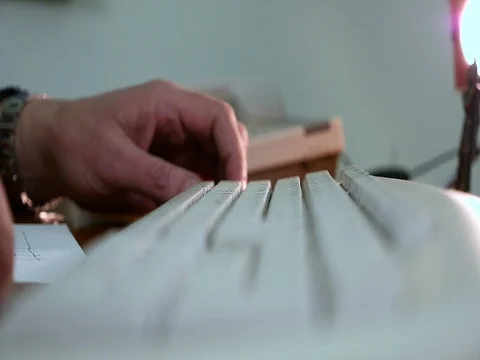 Old man working with keyboard Stock Footage 71530174