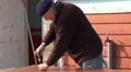 Old man working outside at work bench HD Footage