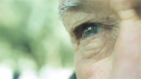Old man's eye portrait: macro shot on sad old man eye  Video stock 48058234