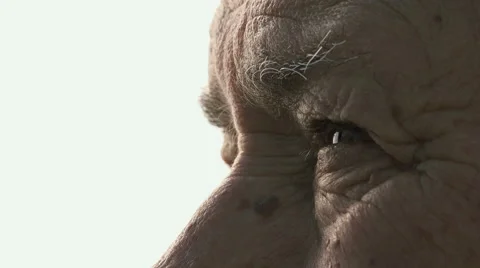 Old man's eyes on white background: elderly man looks  Stock Footage 58301686