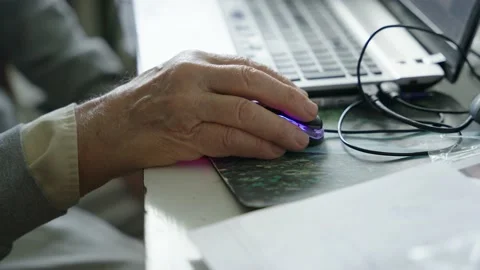 Old man's hand holding computer mouse 動画素材 237454391