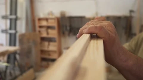 Old man's hand in a woodworking workshop 스톡 동영상 227857412