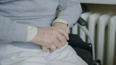 Old man's hands on crossed Stock Footage 237454401