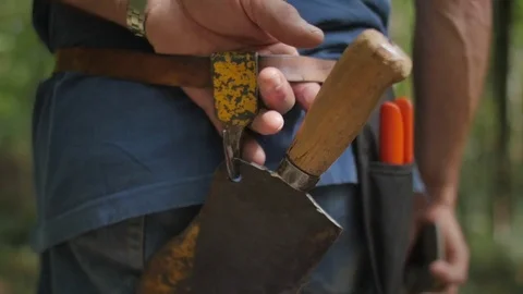Old man's hands holding tool belt Video stock 76559290