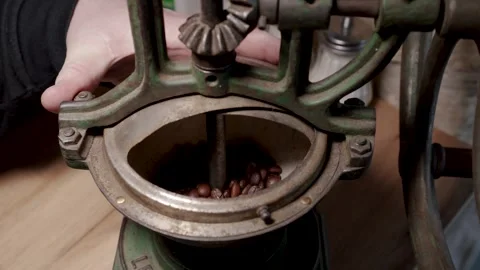 Old manual coffee grinder machine with coffee Видео 261018331