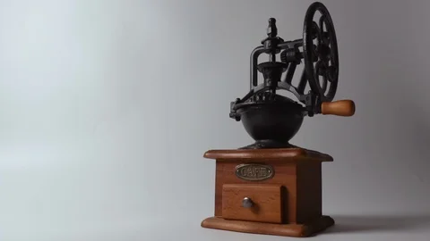 Old manual coffee grinder on a white background 스톡 동영상 124546212