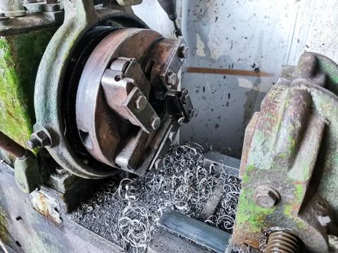 Old manual machine for cutting small metal pipes or products and metal shavin Stock Photos