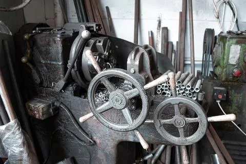 Old manual machine for cutting small metal pipes or products and metal shavin Stock Photos