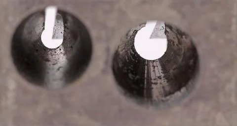 Old manual metal pencil sharpner on white background 库存照片