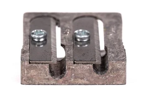 Old manual metal pencil sharpner on white background 库存照片