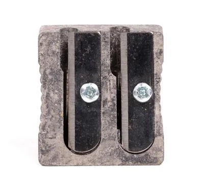 Old manual metal pencil sharpner on white background Stock Photos