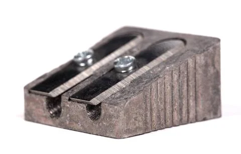 Old manual metal pencil sharpner on white background 库存照片