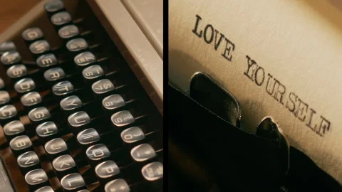 Old manual typewriter types "love yourself" split screen and individual shots Stock Footage 289327495